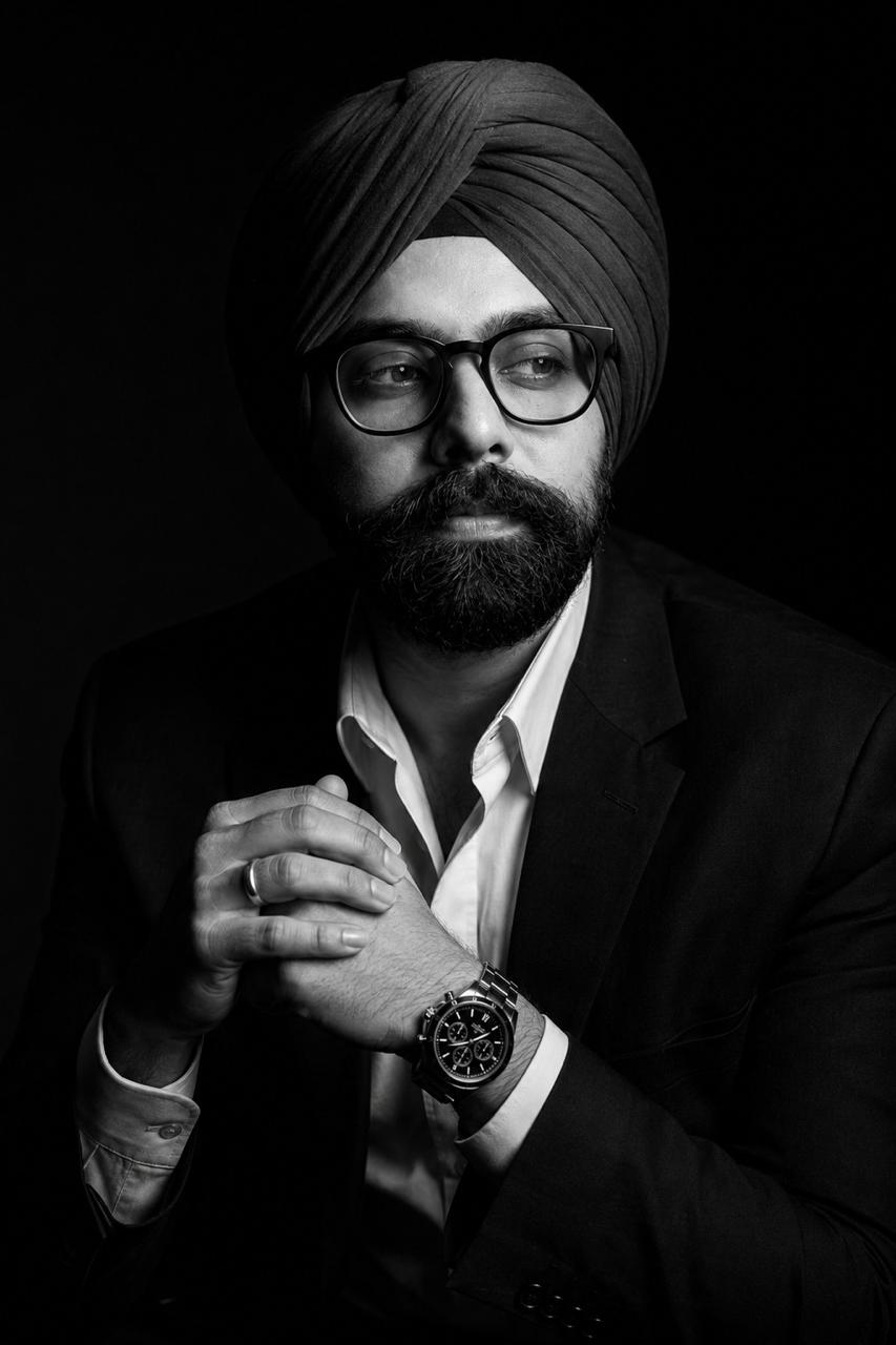 Aman Sandhu, black suit